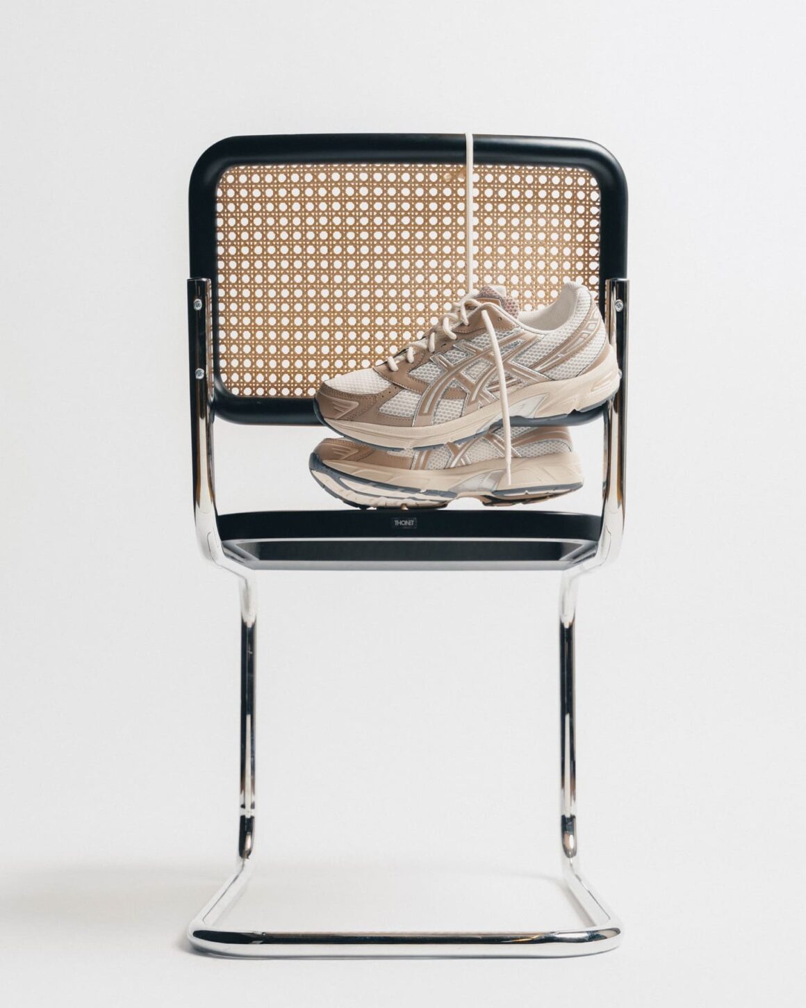 Asics Gel-1130 Cream Cinnamon 1203A609.108 Hanging on chair