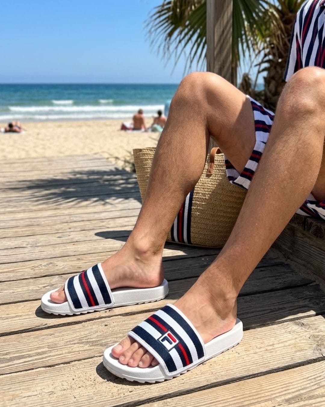 Fila Heritage Slides FTS25110-001 on Feet Beach Outfit