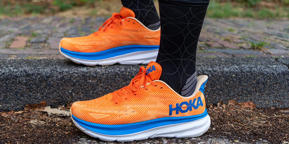 Hoka OneOne Clifton 9 Orange 1127895-VOIM On Feet